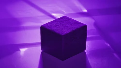 A Purple Cube Illuminated By Light Highlighting Its Aesthetics Ideals and Modernity