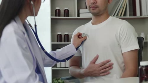 Doctor examining patient by listening lungs and breathing for Acute Respiratory Illness Clinic