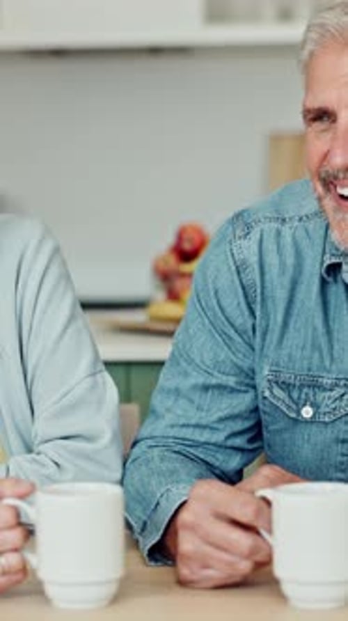 Senior Couple Enjoying Coffee and Affectionate Moment