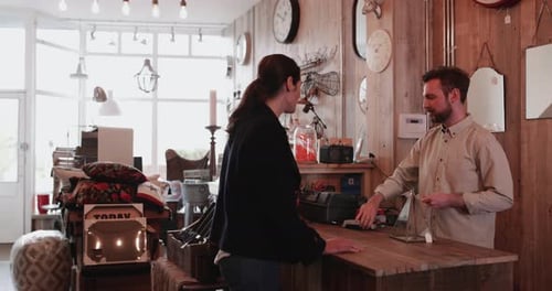 Customer paying with credit card in a home store