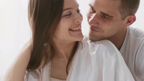 Happy Couple Embrace After Positive Pregnancy Test