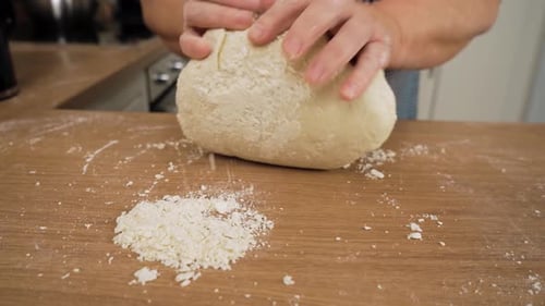 Kneading Dough Ball on Floured Table Unrecognizable Person Pressing Mixture with Hands Working Soft