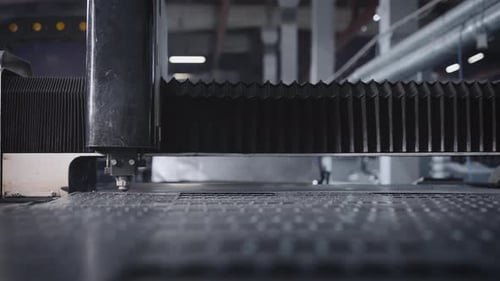 The Process of Cutting Parts From a Sheet of Metal Using a CNC Machine