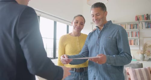 Realtor showcasing a home with potential buyers