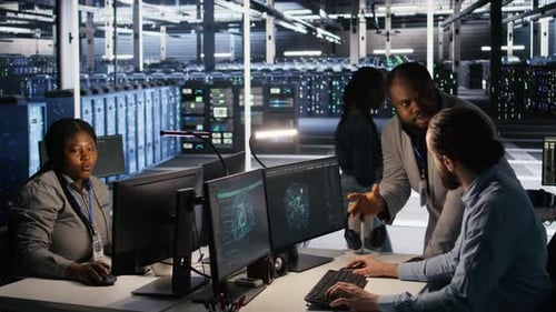 Server Farm Manager Overseeing Engineer Examining Neural Network Algorithms