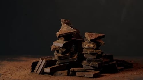 Spinning Amidst a Cocoa Cascade Chocolate Pieces Reveal Their Richness A Sight That Connects with
