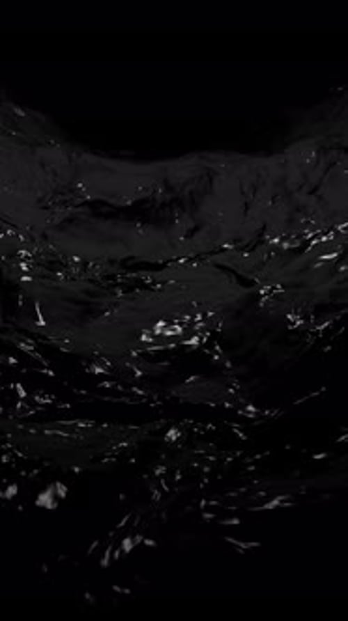 Vertical Video - Flowing Stream of Black Crude Oil Background