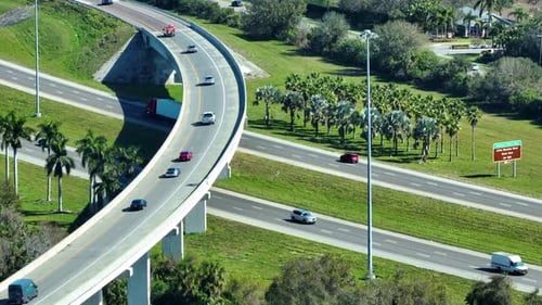 Freeway Overpass Junction with Fast Moving Traffic Cars and Trucks in American Rural Area Interstate