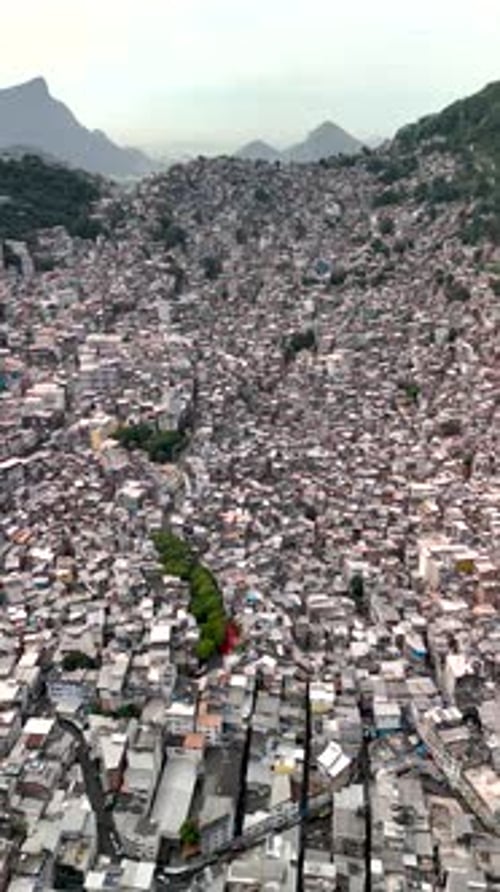 Drone Flying Over Favela Rocinha With Endless Houses, Mountains in Background