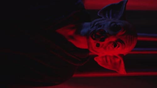 Grotesque Sculpture Bathed in Eerie Red Light