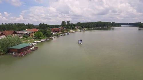Boats And Houses By The River