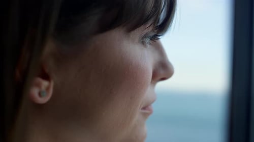 Woman Thinking at Office Window Sea View