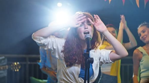 Energetic Singer Performing with Band at Nightclub