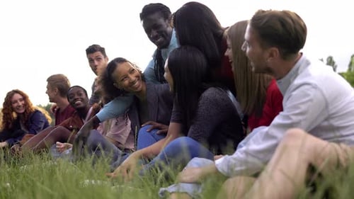 Happy multiracial people having fun outdoor in city park - Friendship lifestyle concept