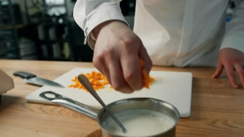 Preparing Carrots and Sauce in Professional Kitchen
