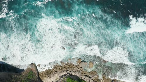 Aerial view of waves reaching the coast