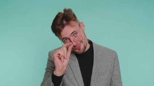 Business Man Showing Little Bit Gesture with Sceptic Smile Showing Minimum Sign Measuring Small Size
