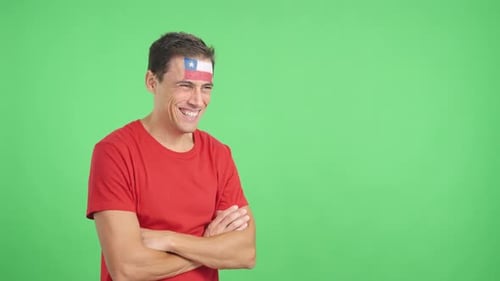 Man in Red Shirt Smiling with Flag