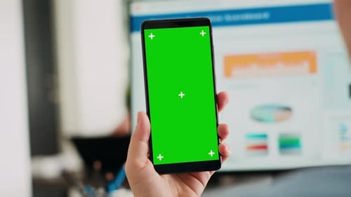 Mobile Phone with Green Screen in Office Setting