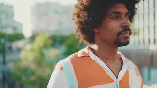 Close Up of Man With Curly Hair Outdoors