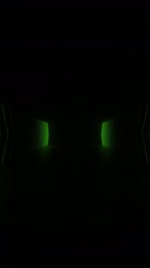 A tunnel illuminated by green neon lights, creating a mesmerizing visual effect.