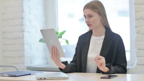 Woman Using Tablet for a Video Conference
