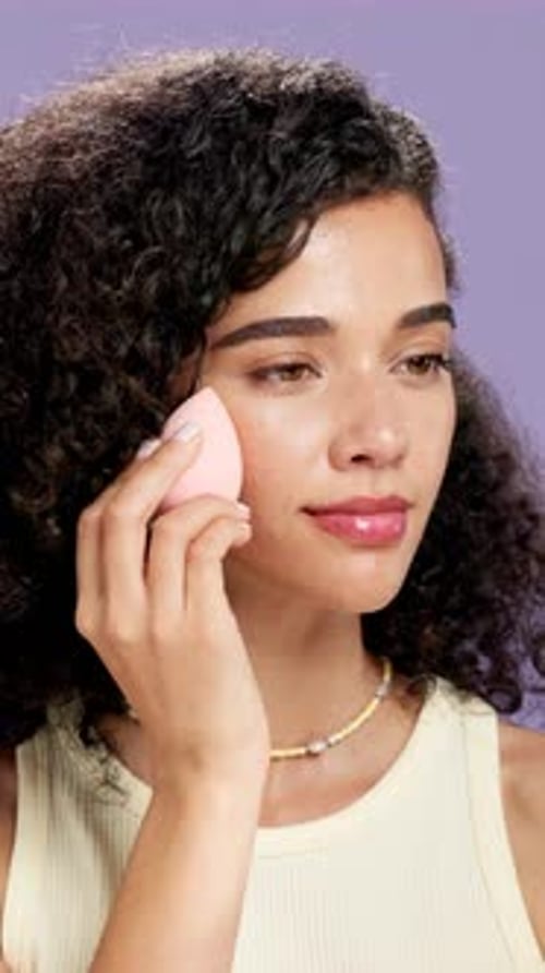 Beauty, makeup and woman with blender, studio and foundation application with equipment