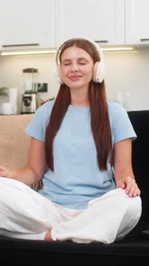 Woman Meditating with Headphones at Home, Relaxation