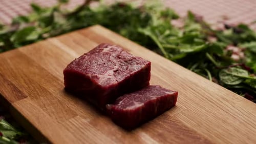 Close Up of Raw Red Meat on Cutting Board