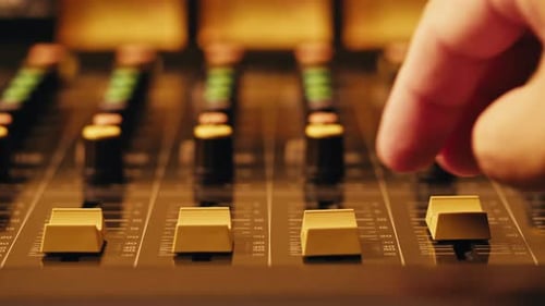 Music Studio Close Up Close Up Hands Shot of Sound Engineer Using Mixing Console Remote Control for