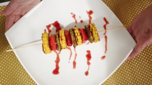 Vegetarian food, shish kebab barbecue corn, bell pepper and vegetable patty