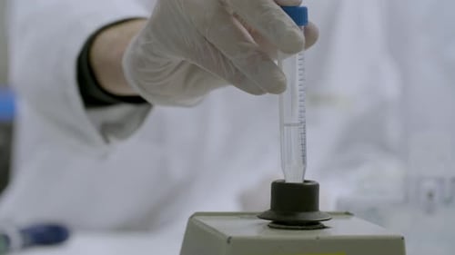 Inserting medical Sample in Laboratory Vortex Mixer