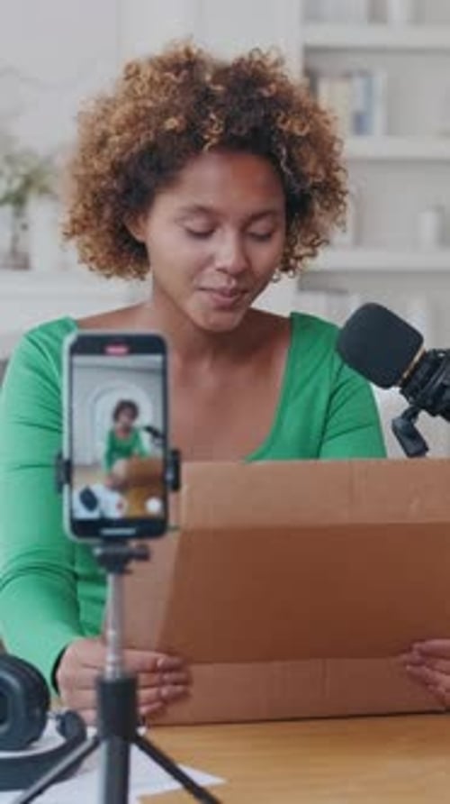 Unboxing Experience With Excitement and Curiosity in Bright Studio Setting