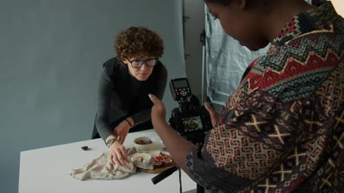 Adults Styling and Photographing a Food Display