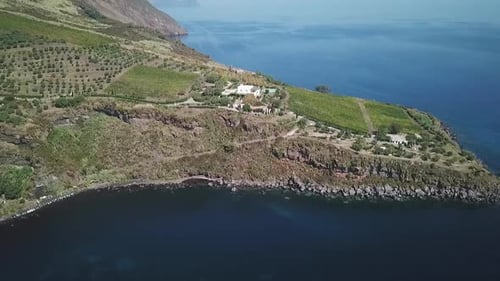 Drone opening shot of the Volcano island in Italy, Sicily, Lipari archipelago. View on islands and s