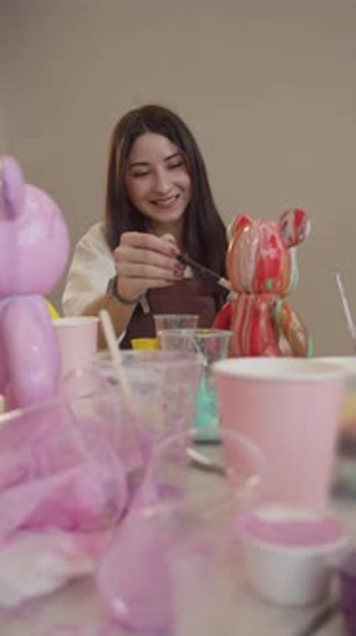 Woman Painting Figurine with Fine Brush