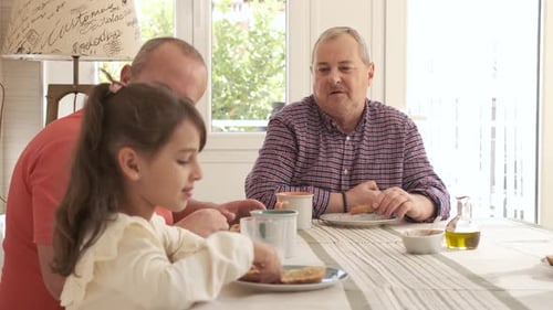 Family Enjoying Breakfast Together at Home