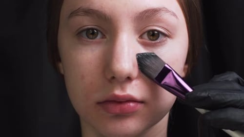 Makeup Artist Does Makeup to Client