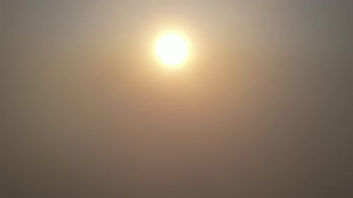 Aerial view of golden sunrise above the clouds, peaceful and uplifting natural beauty