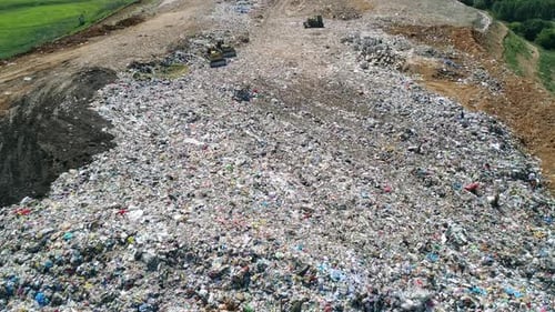 Aerial View of Large Garbage Landfill Trash Dump Flocks of Birds Circling Over the Garbage Dump