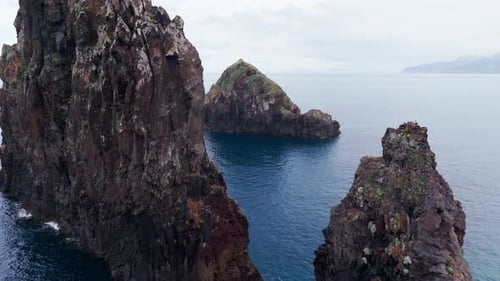 Serene Waterway Filled with Jagged Rocky Outcroppings and Distant Horizons