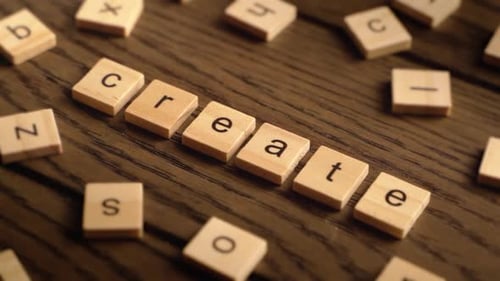 Letter Blocks Spell 'Create' on Wooden Table