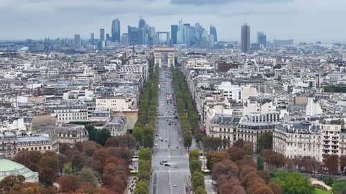 Flight over Avenue des Champs Elysees towards Arc de Triomphe in Paris