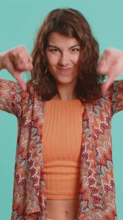 Woman gives thumbs down with bad review