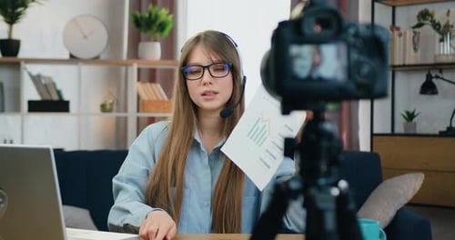 Woman Presenting Charts During a Video Conference