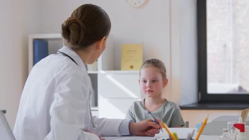 Medicine, Healthcare, Pediatry and People Concept - Female Doctor or Pediatrician With