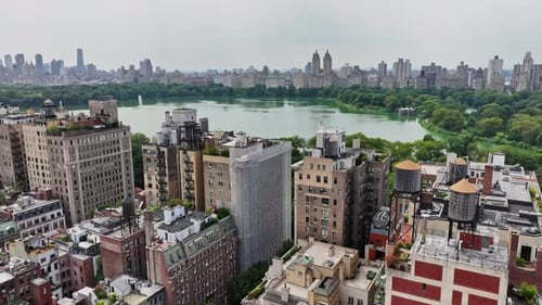An aerial view of a city with a lake in the background