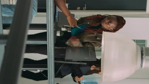 Two Coders Work Together in Office