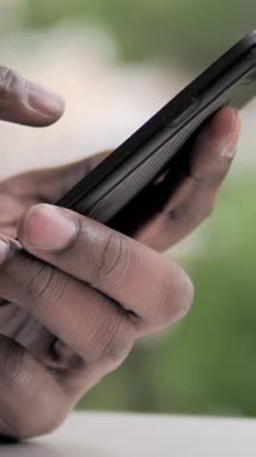Adult Using Smartphone, Close-Up of Hand