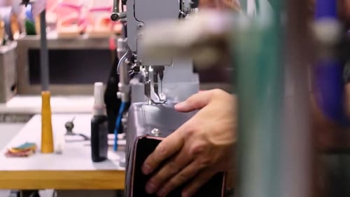 Italian shoemaker, making leather bag with traditional machines.
Location: South Tyrol, Italy